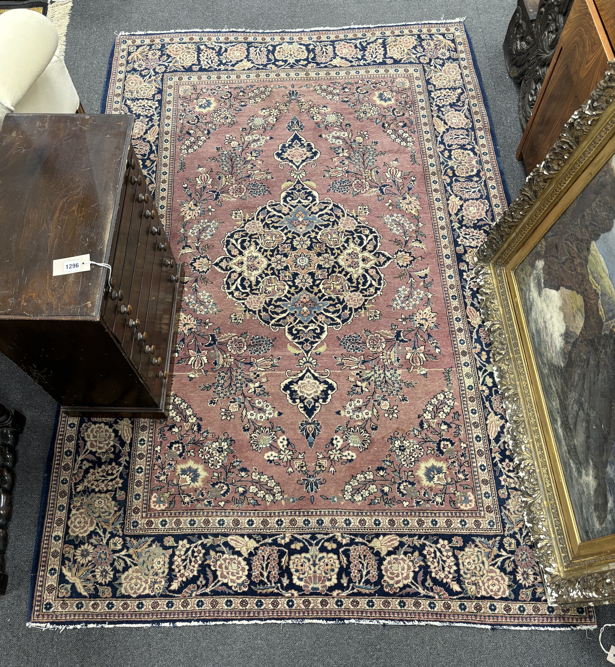 A Kashan mauve ground rug, 202 x 133cm